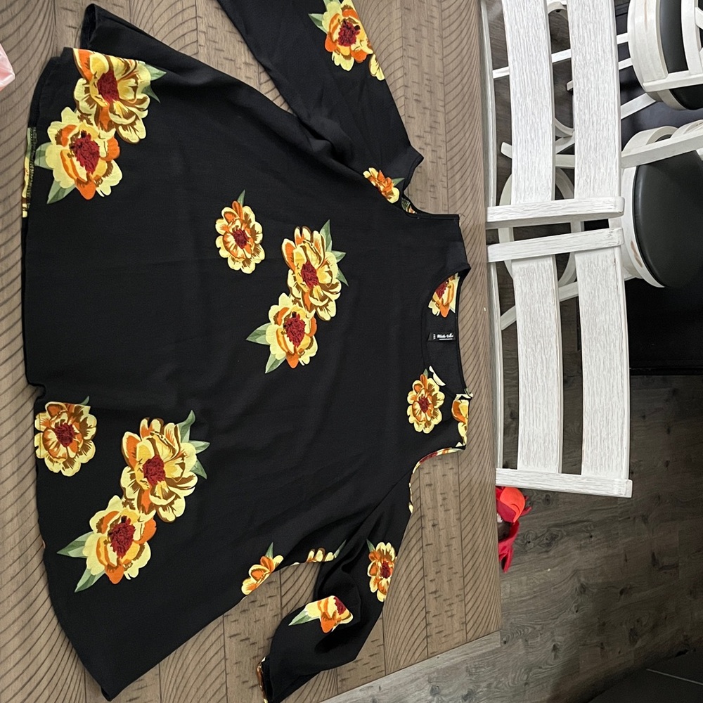 White Mark Black Top with Vibrant Floral Design